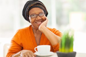 senior african american having coffee at home